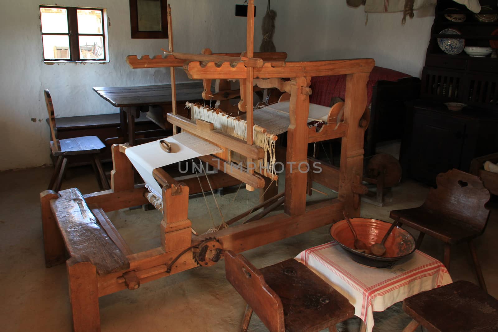 A rustic rural wooden loom room inside.