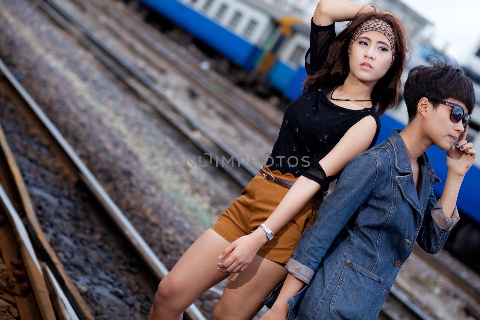 fashion portrait asian two girl in train station.portrait fashion on outdoor.