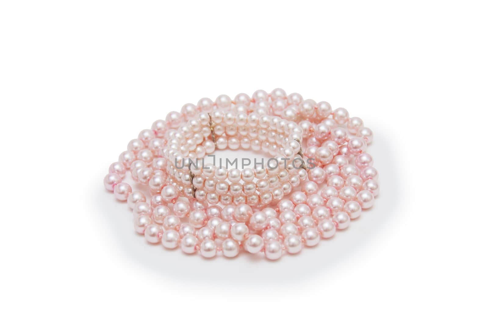 Pearl necklace on white background.  by cocoo