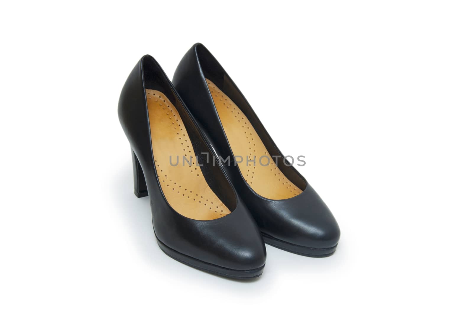 Close-up of female high-heeled shoes over white background 