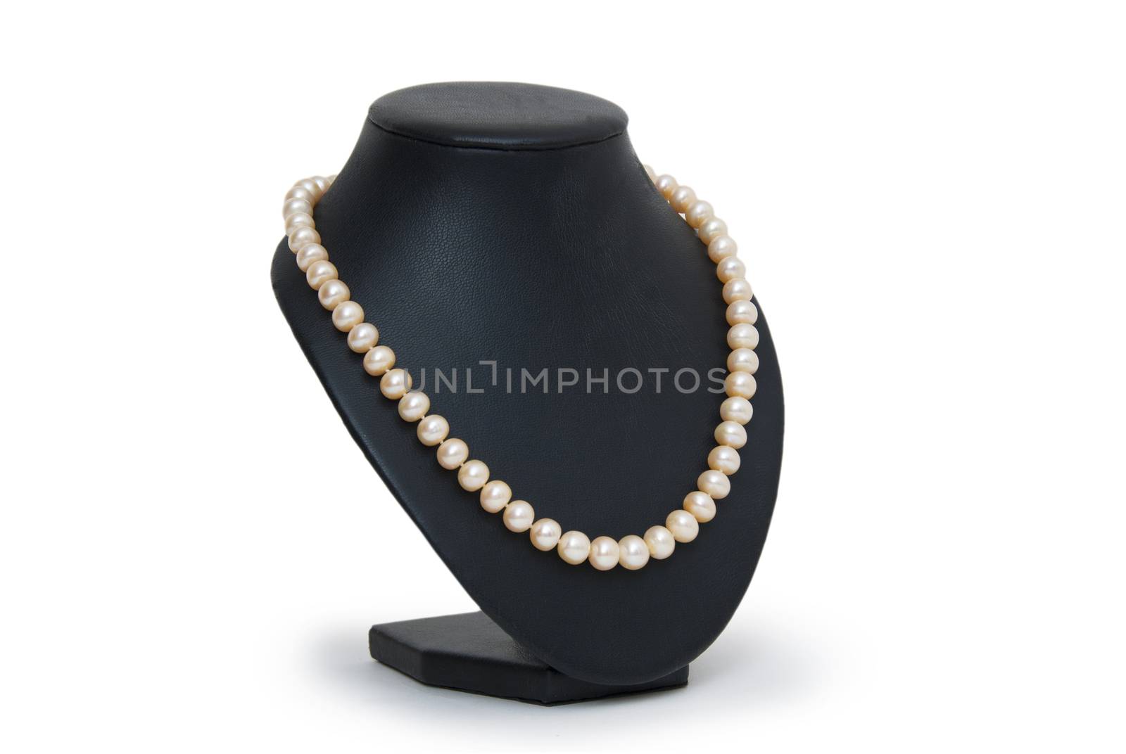 Pearl necklace on black mannequin isolated 