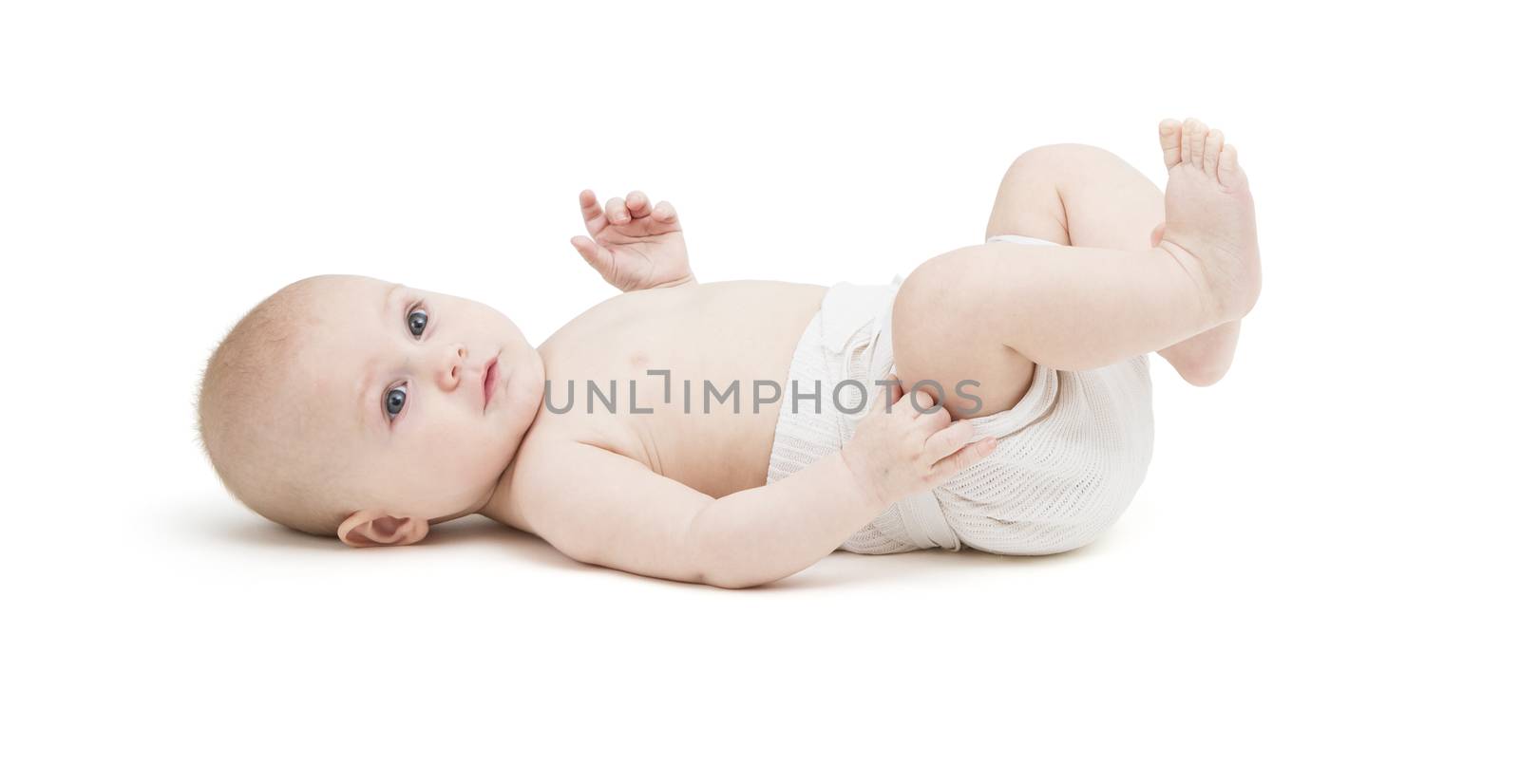 toddler in diaper lying on back. isolated on white background