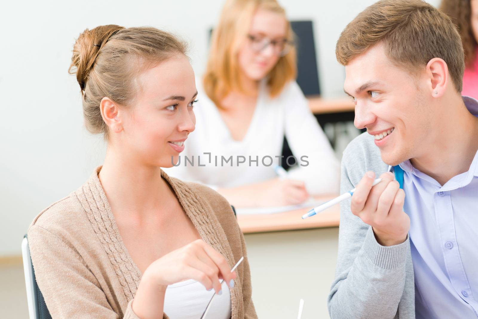 image of a two students in the class talk