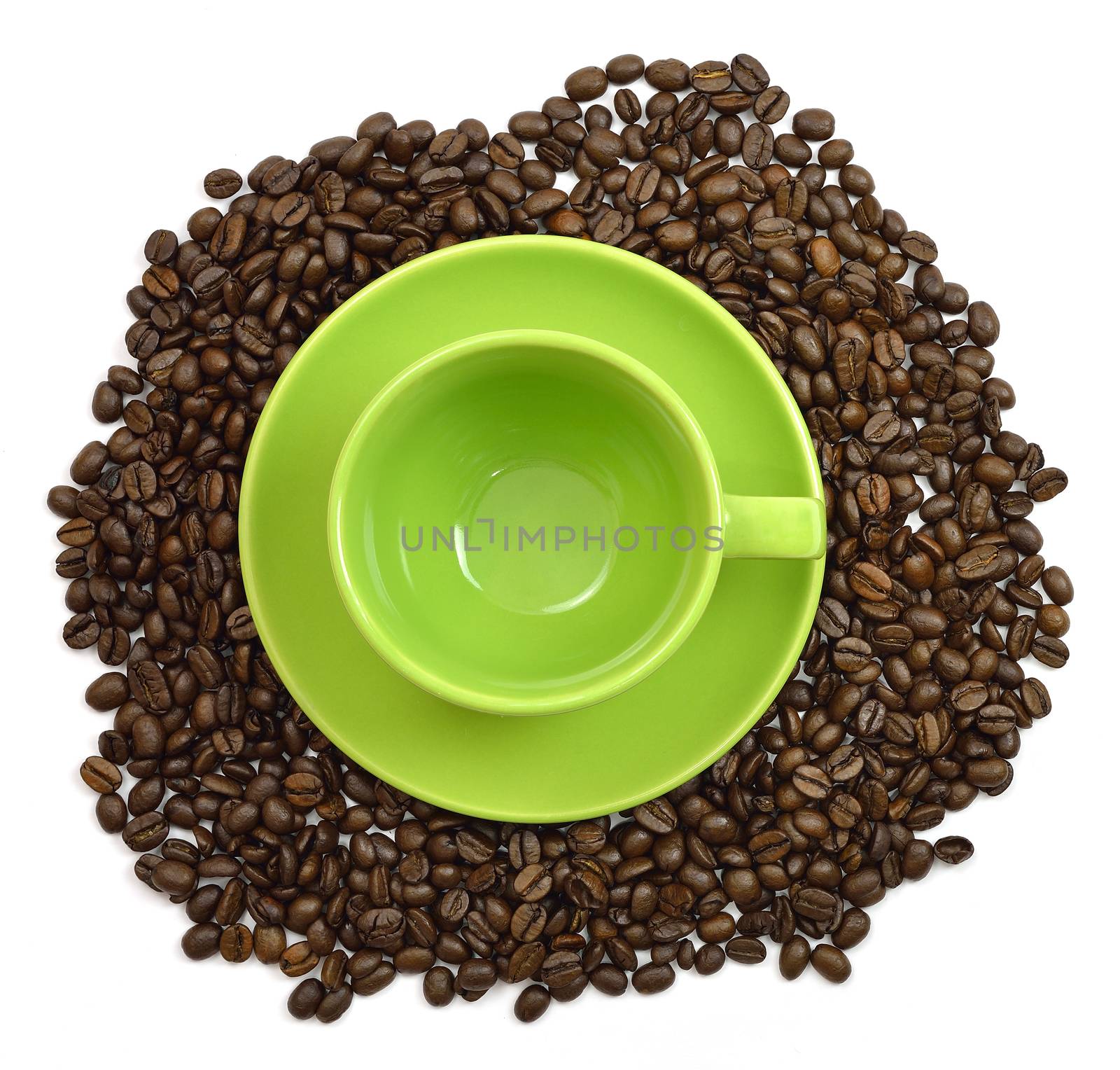 Green cup and saucer in the coffee beans by cherezoff