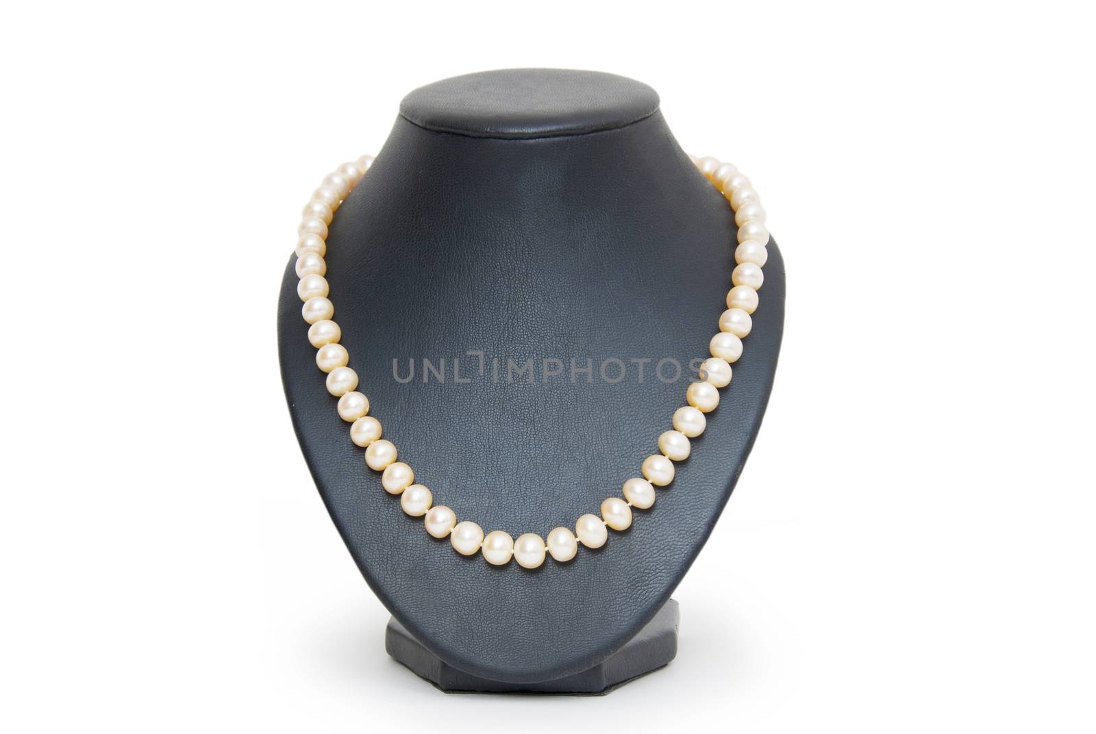 Pearl necklace on black mannequin isolated 