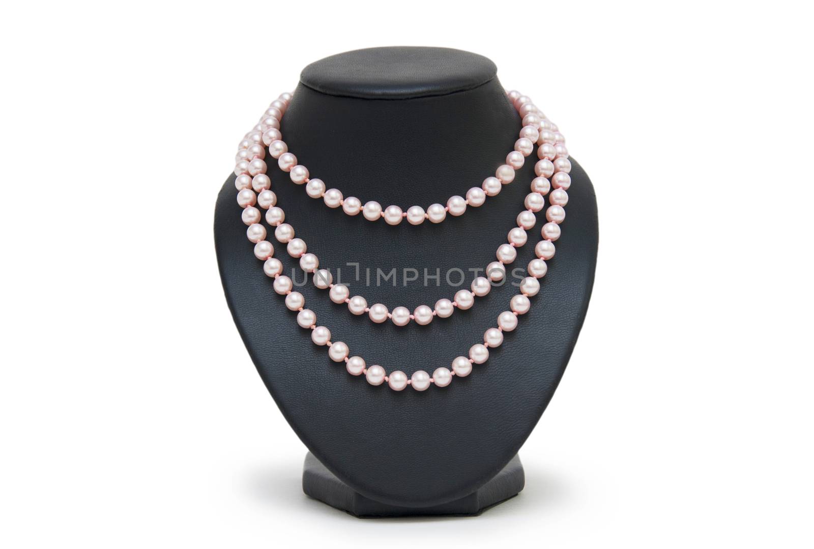 Pearl necklace on black mannequin isolated 