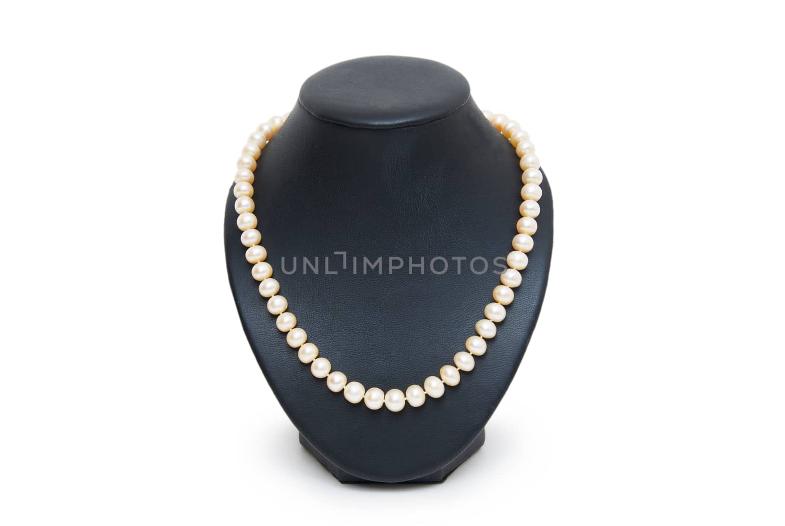 Pearl necklace on black mannequin isolated by cocoo