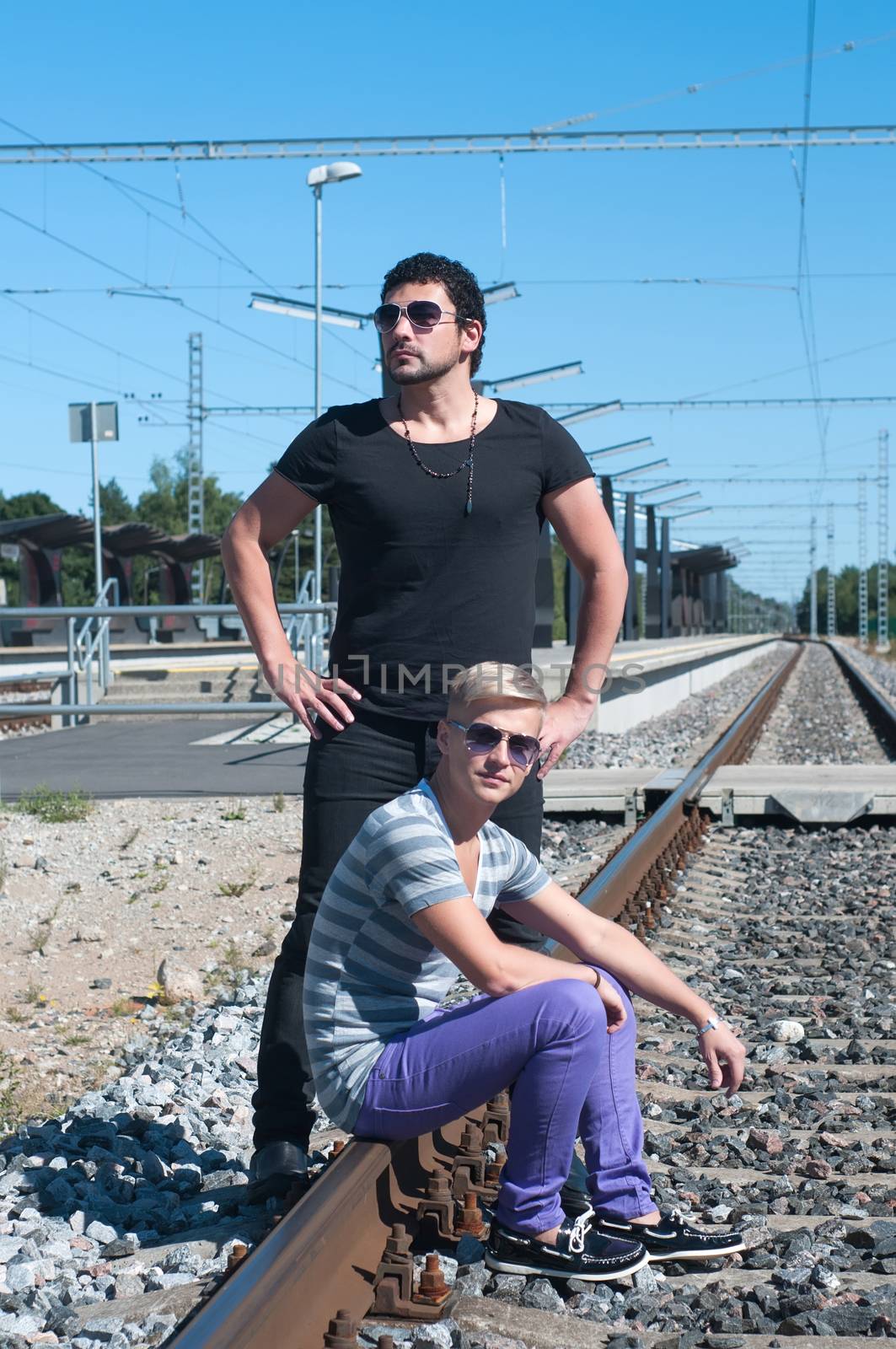 Two guys on train tracks by anytka