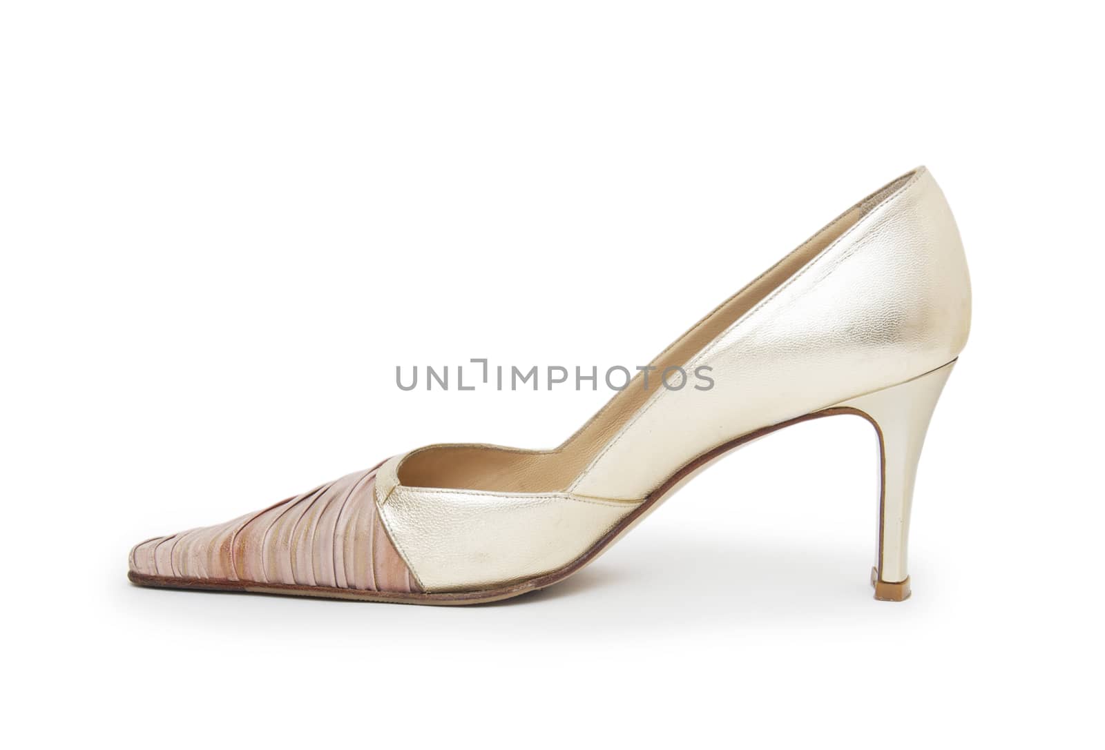 Biege high heel shoes isolated on white  by cocoo