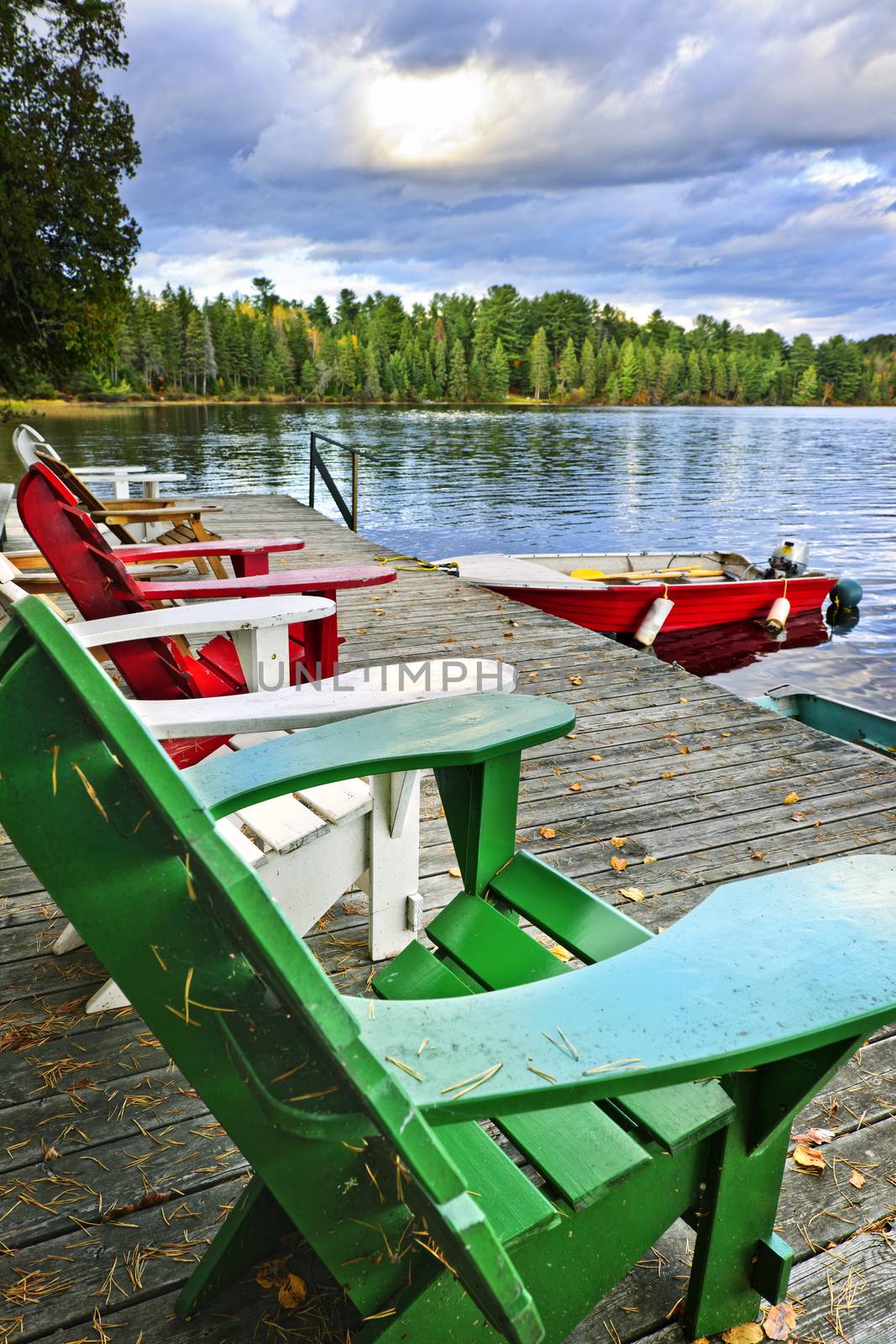 Deck chairs at dock on Lake of Two Rivers in Algonquin Park, Ontario, Canada