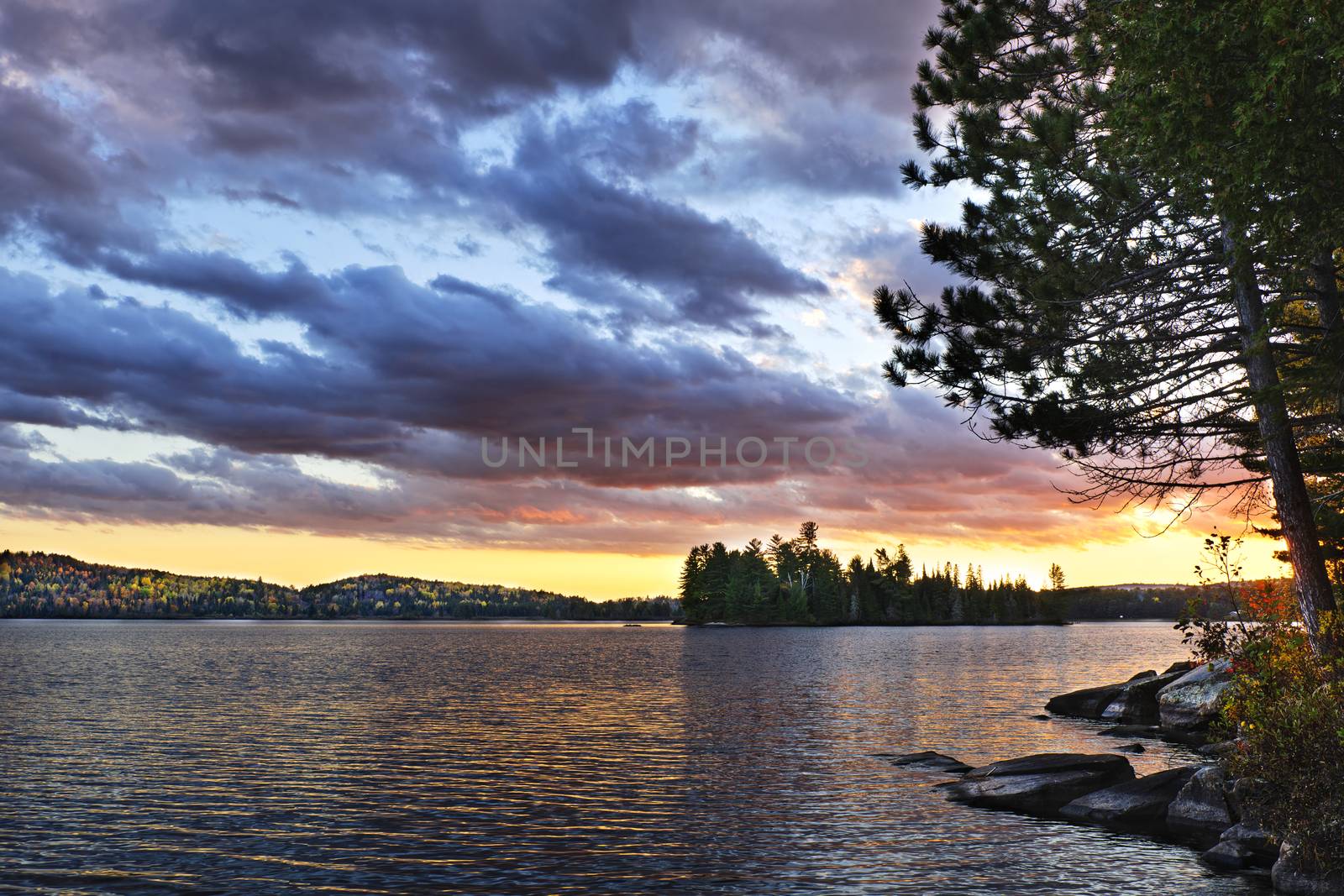 Dramatic sunset at lake by elenathewise
