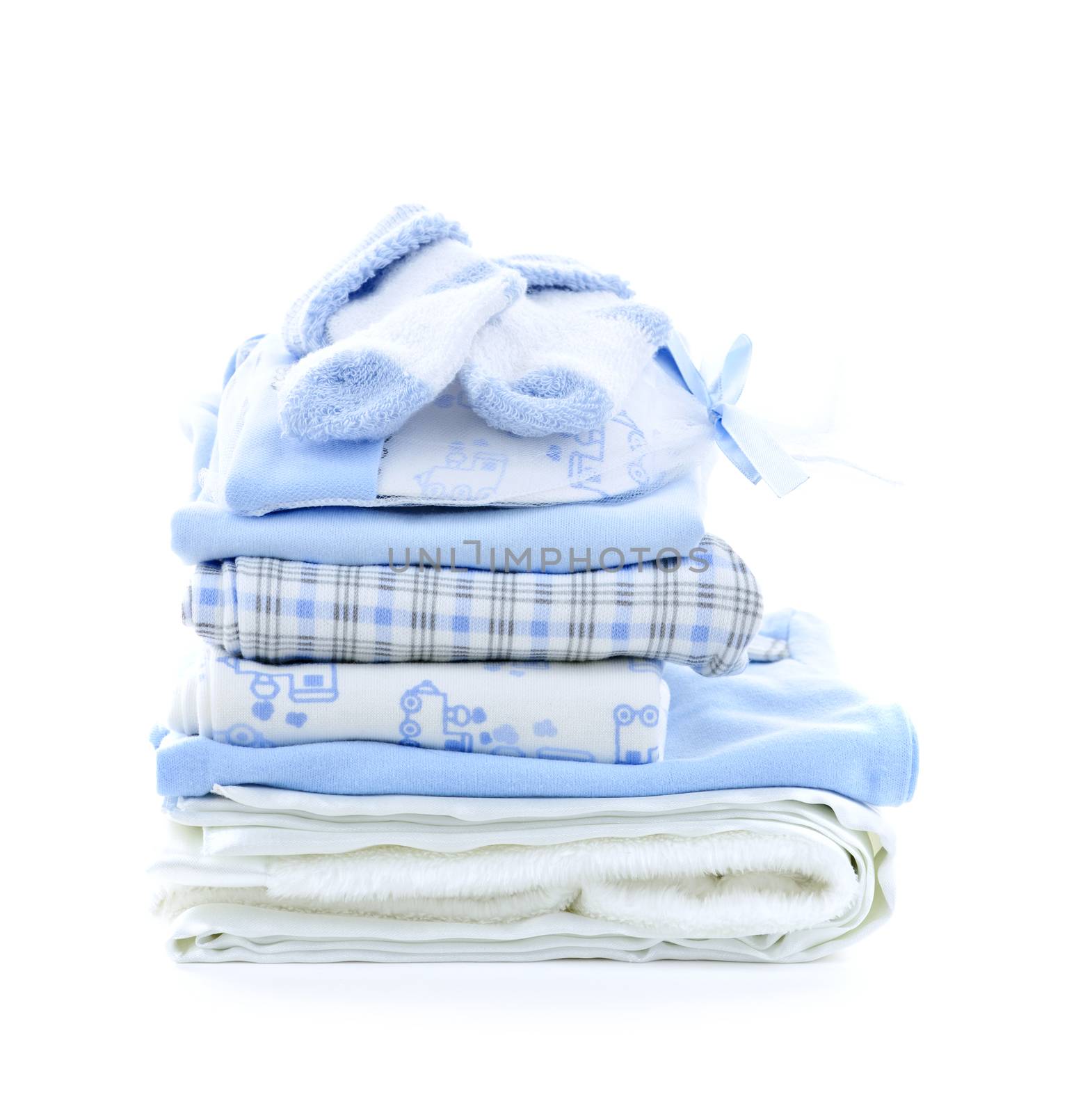 Stack of blue infant clothing for baby shower isolated on white background