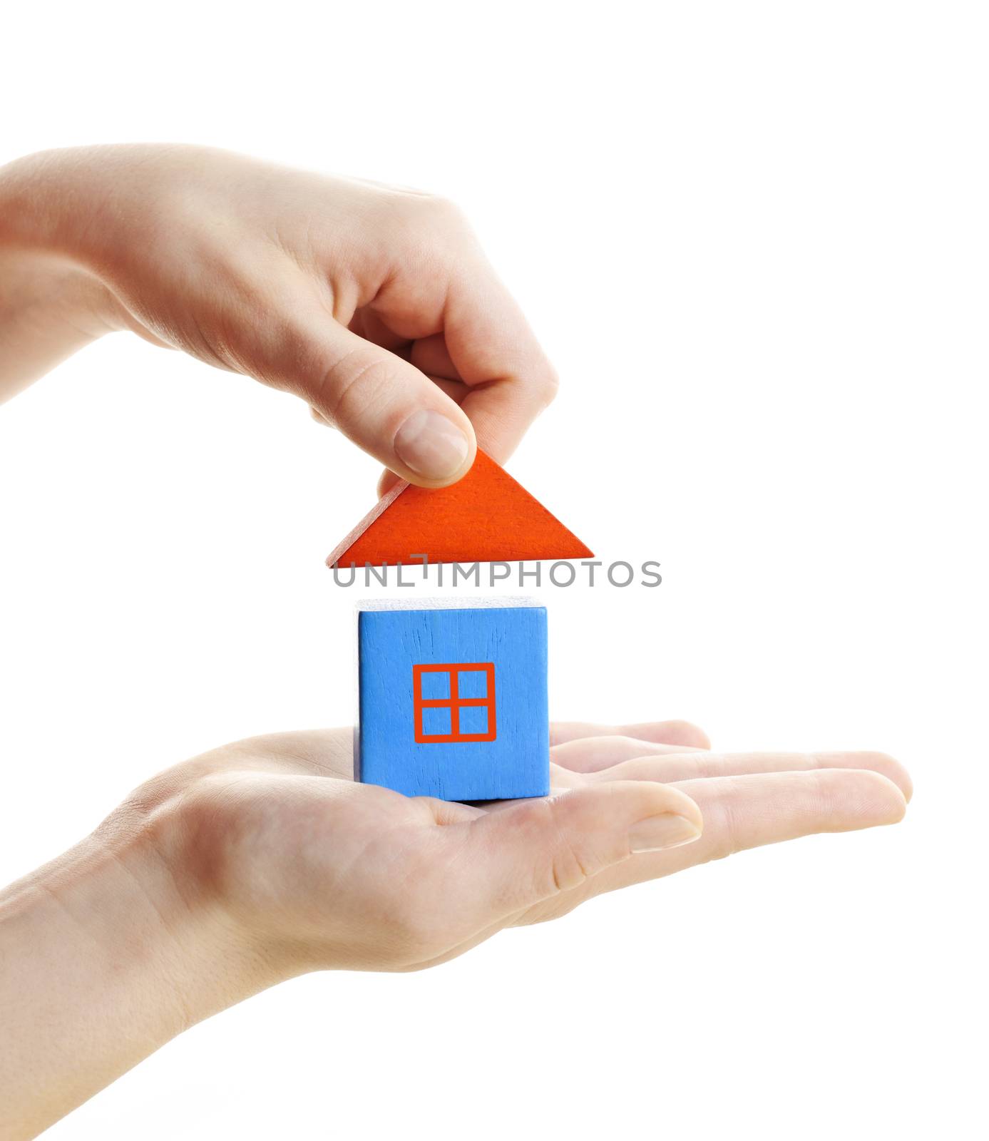Hand building wooden block toy house isolated on white background