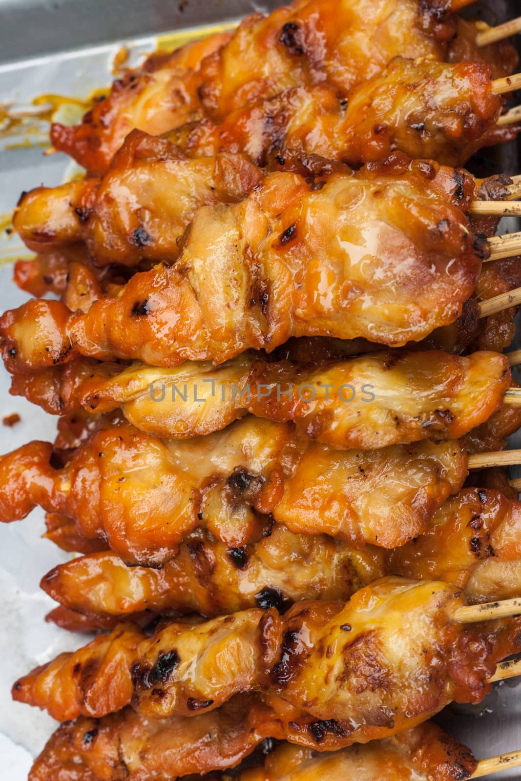 Chicken Grill with wooden stick by yanukit