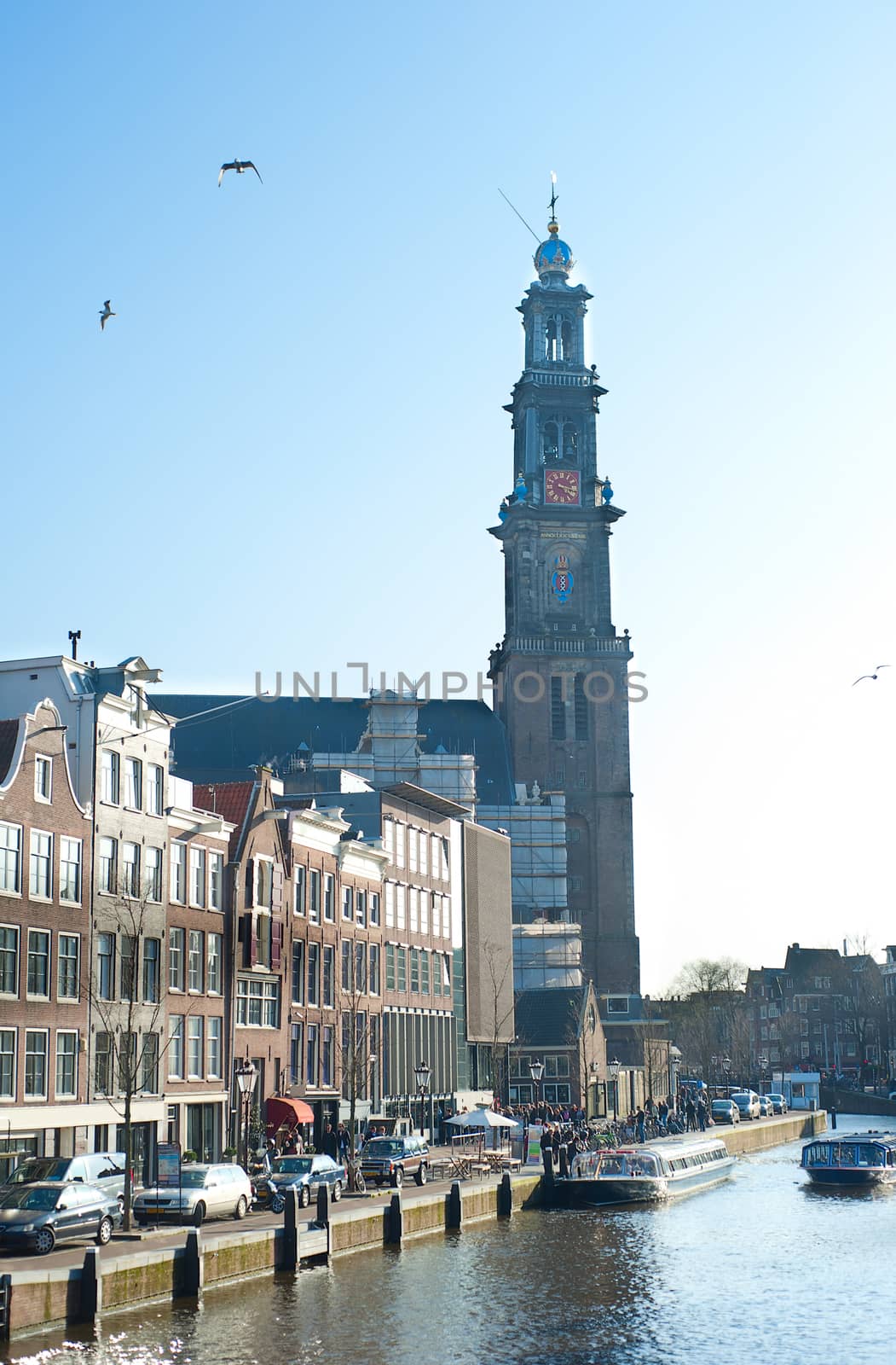 Prinsengracht street  with old Western Church in Amsterdam, Netherlands