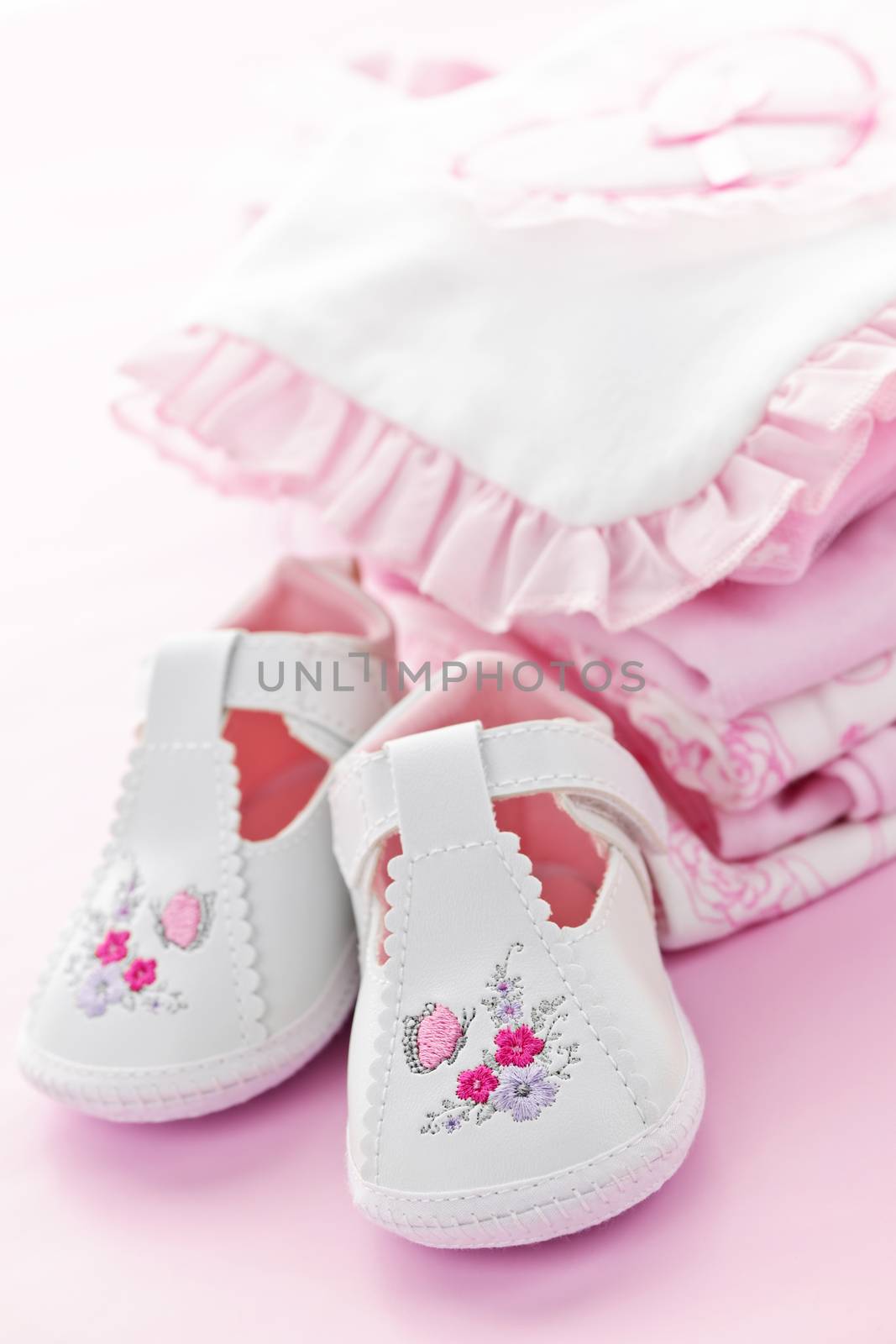 Pink infant girl clothing and shoes for baby shower