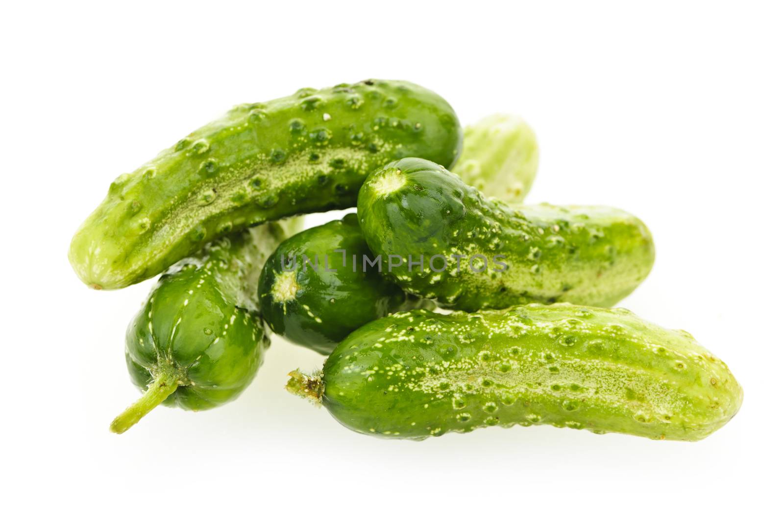 Cucumbers on white by elenathewise