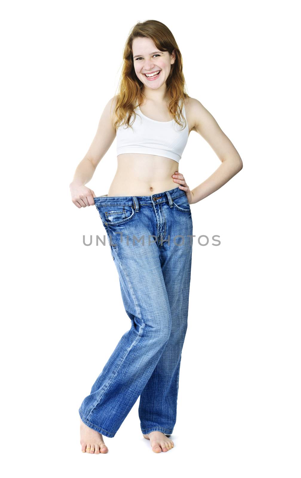 Happy girl in jeans after losing weight by elenathewise