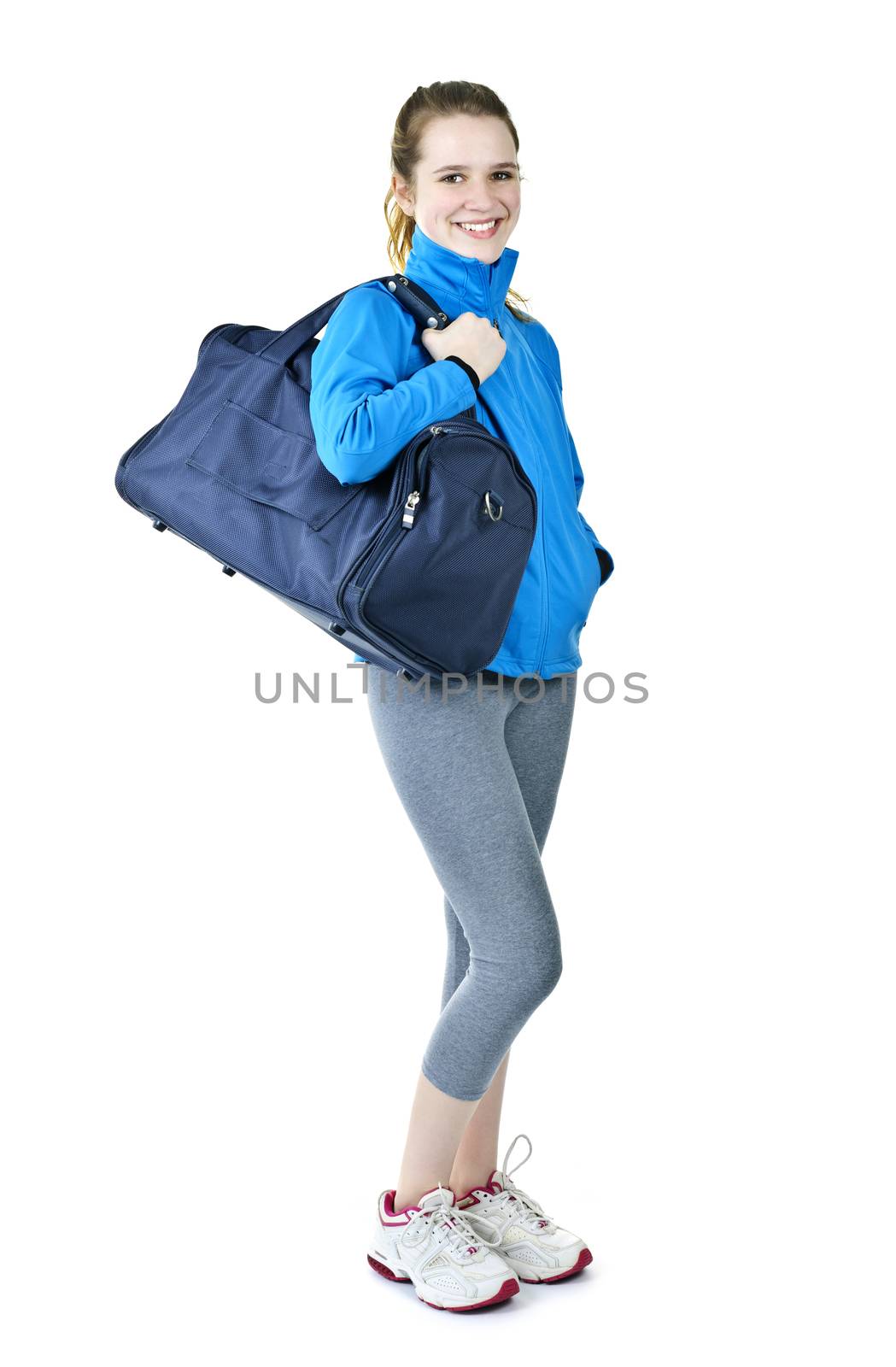 Athletic girl with gym bag ready for workout by elenathewise