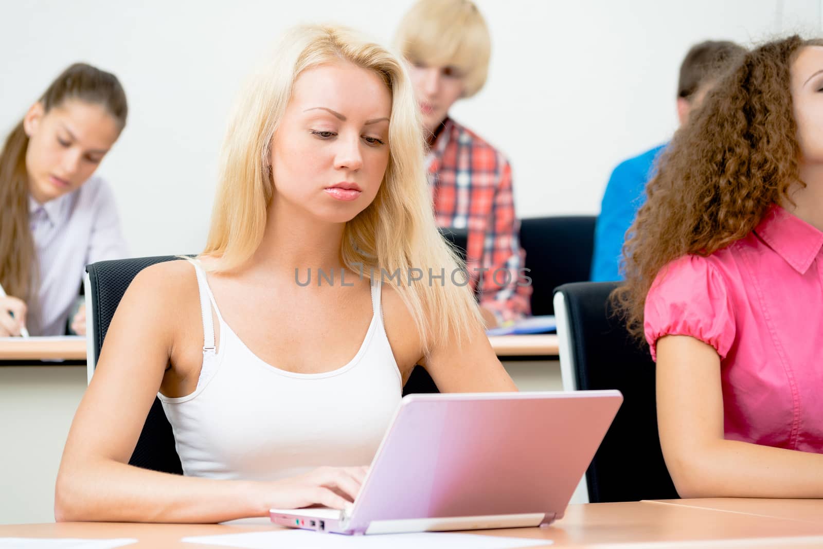 portrait of young female student in the classroom, teaching at the University of