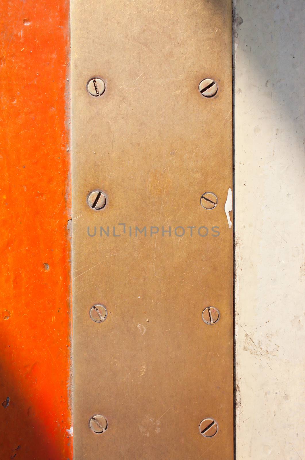 Brass metal plate with screw heads, texture