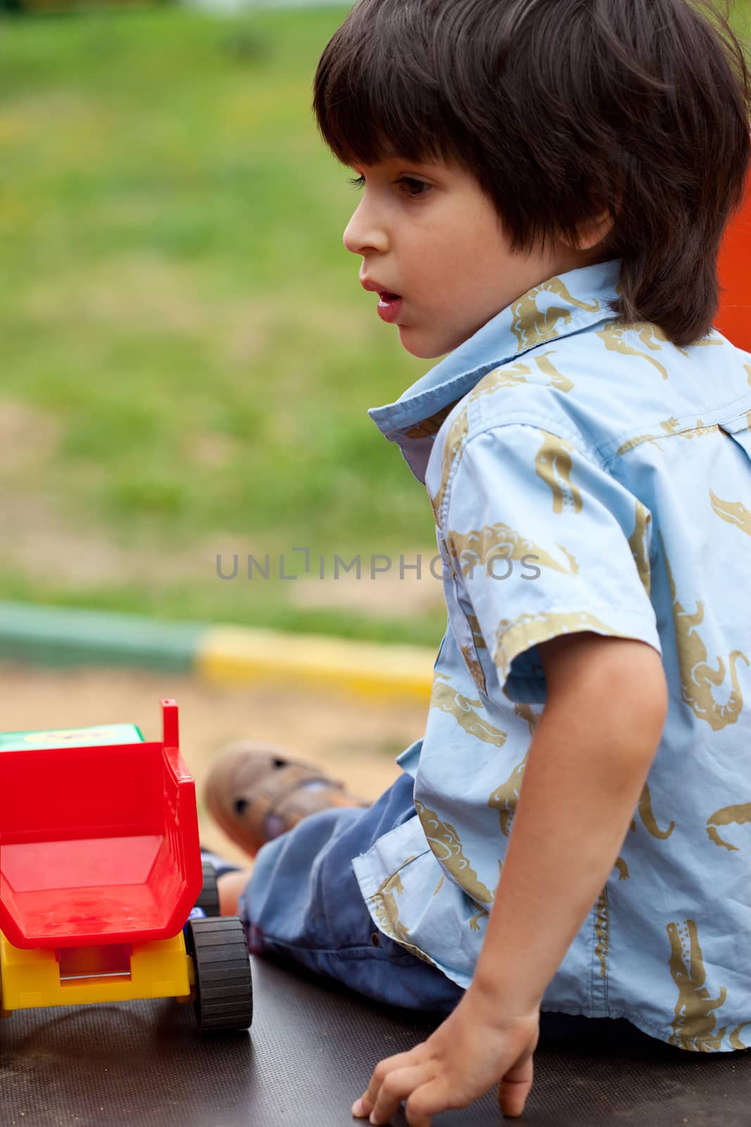 portrait of a young boy on the open air