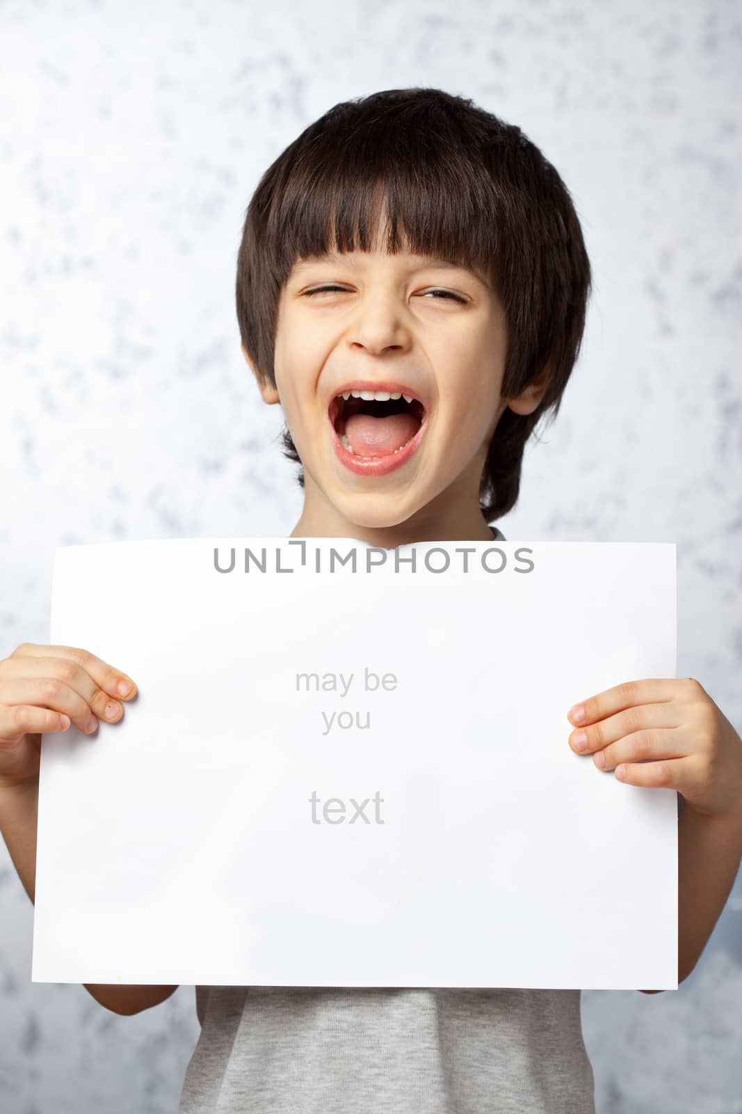 laughing boy with a poster in hands by Astroid