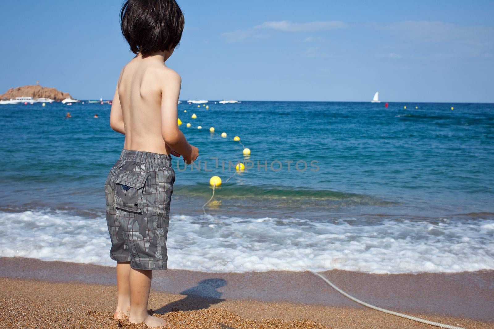 boy looking at the blue sea by Astroid