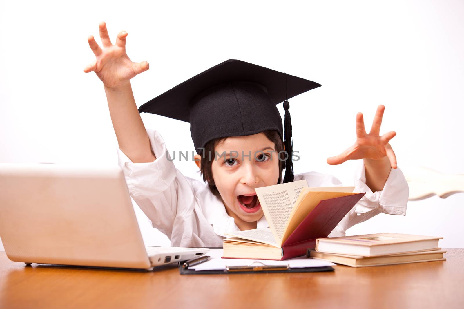expression little boy in hat with computer and textbooks on white background 