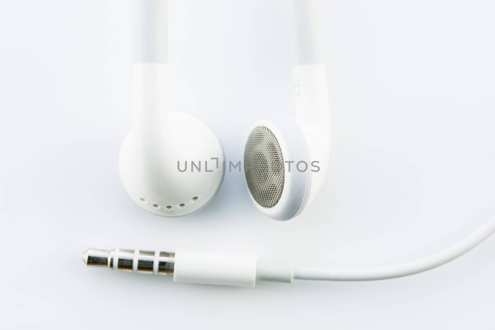 White earphones isolated by Sorapop