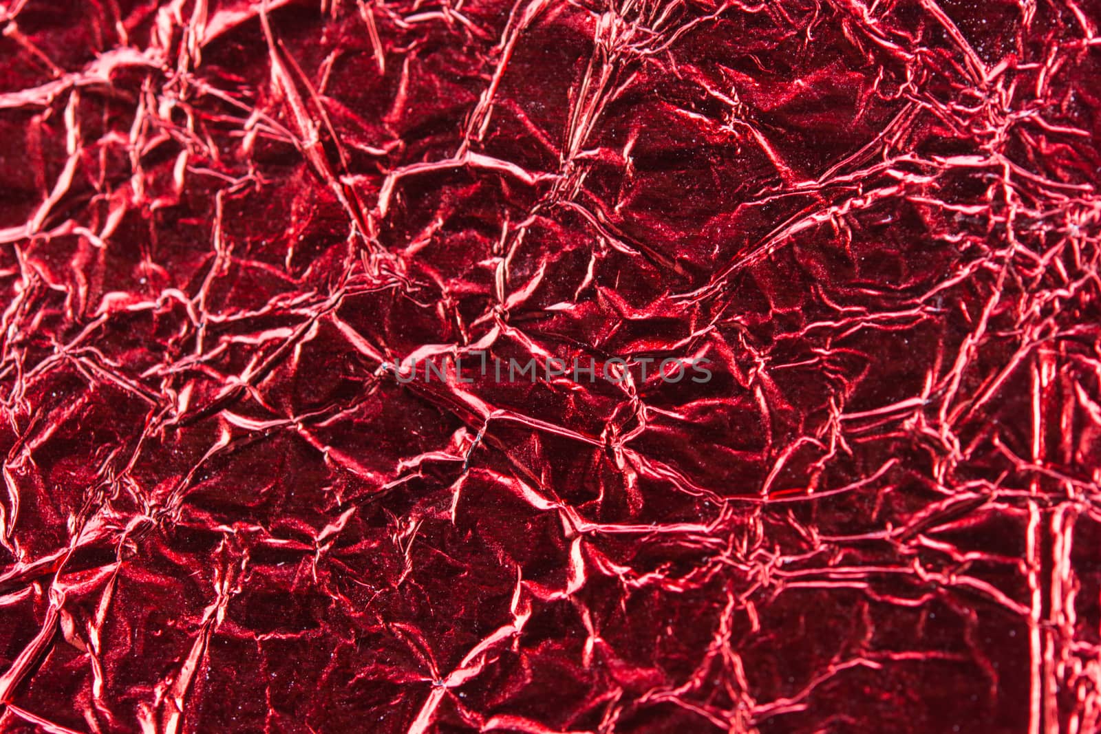close up of red aluminum foil texture background