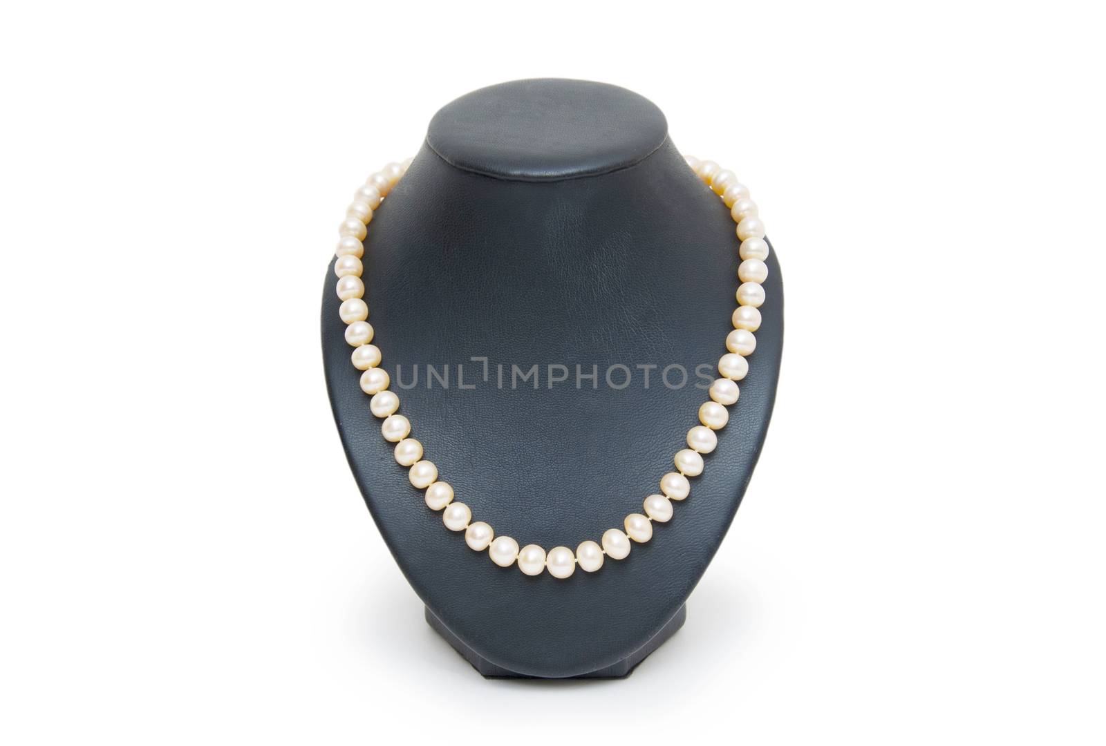 Pearl necklace on black mannequin isolated by cocoo