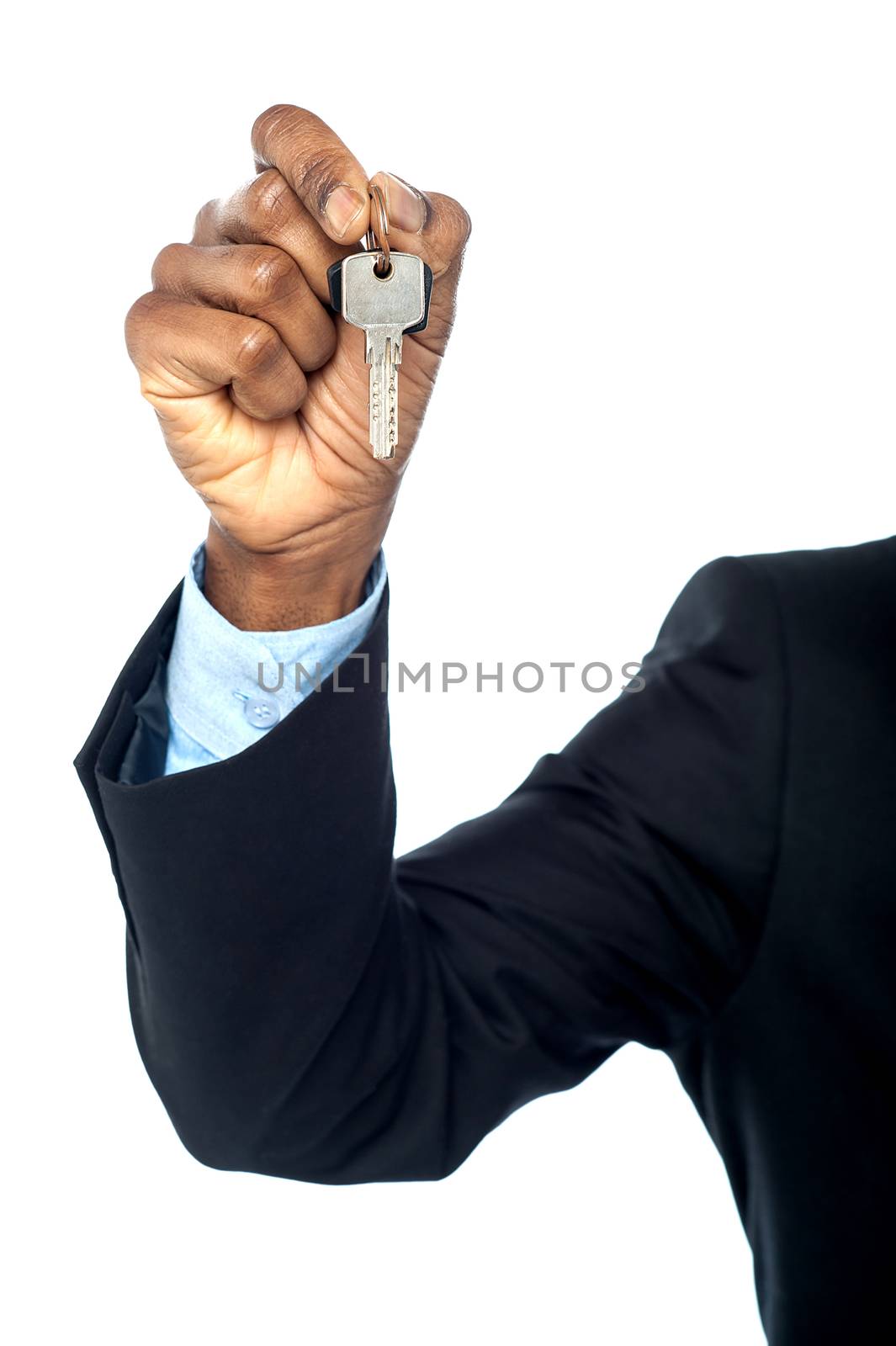 Cropped image of a man holding car key