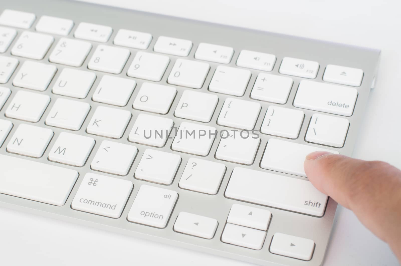 Enter white computer keyboard and on white background