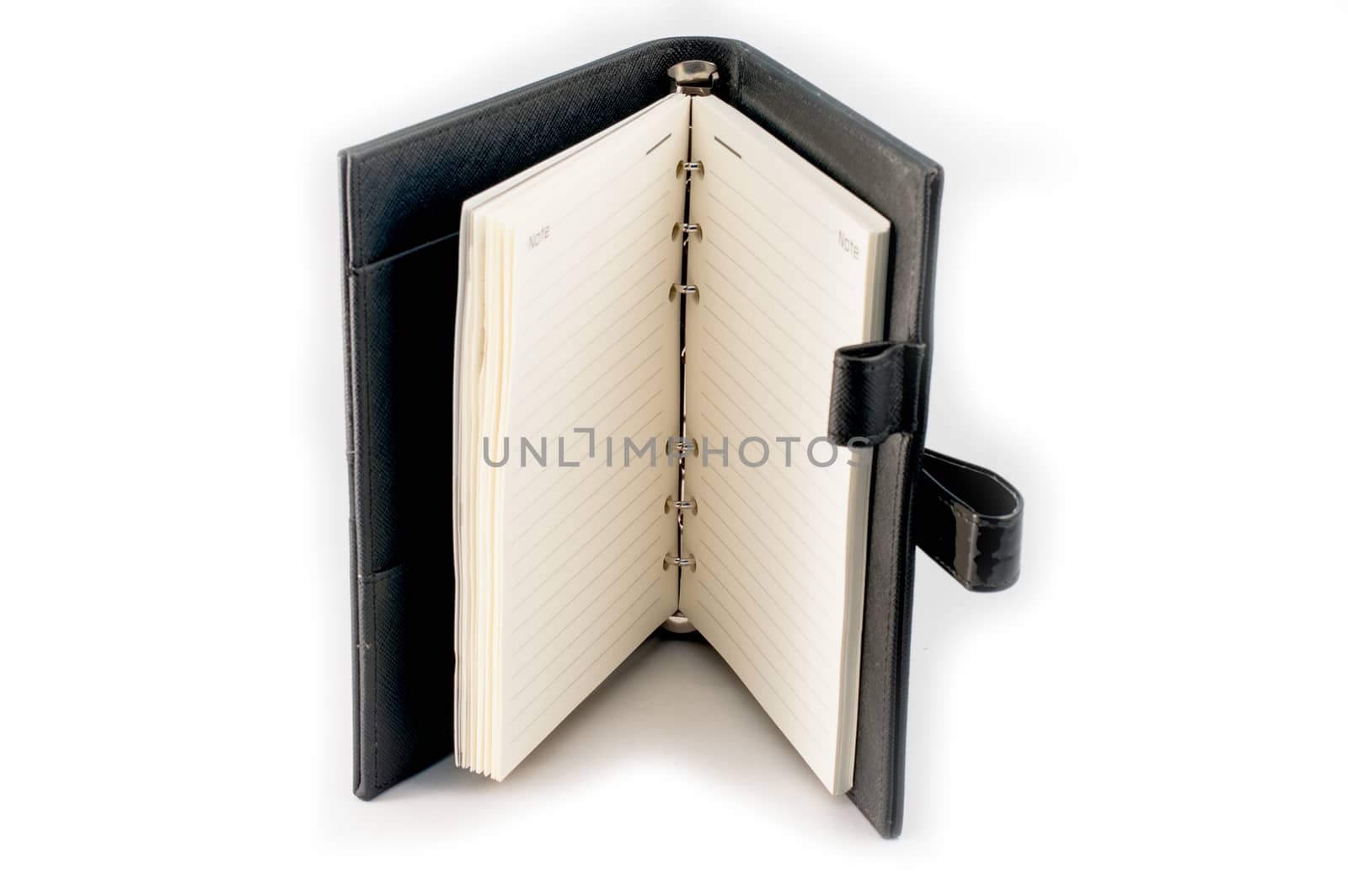 Black note book open on white background