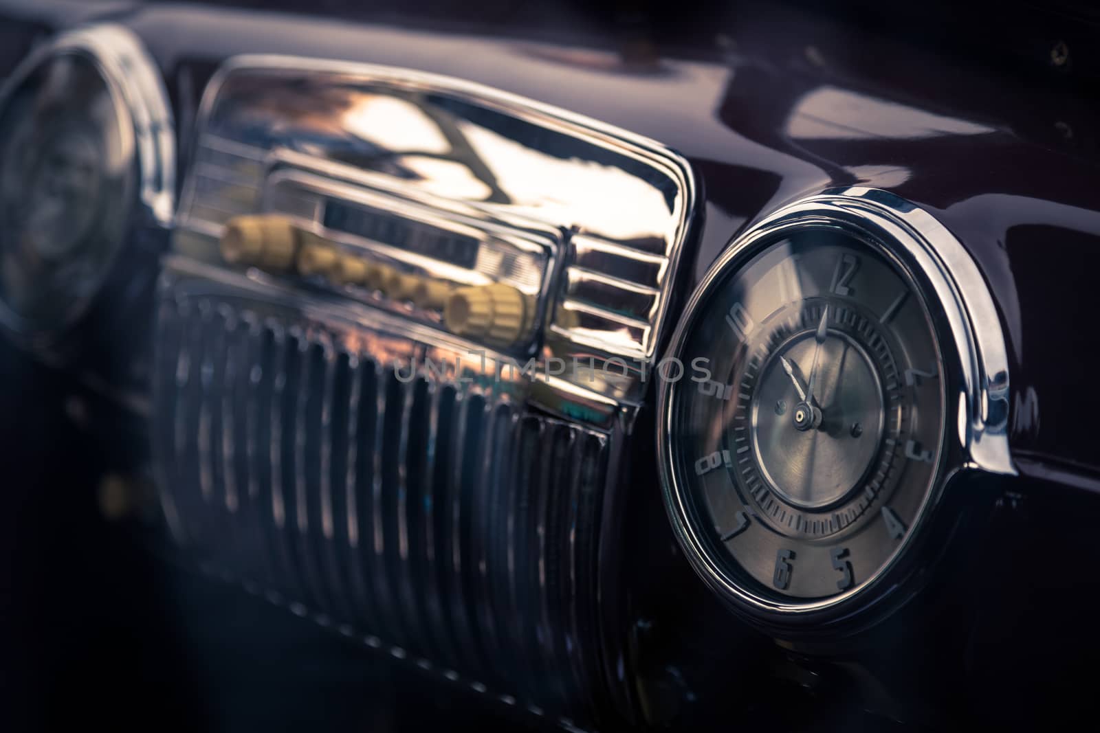 Clock in retro interior of old automobile