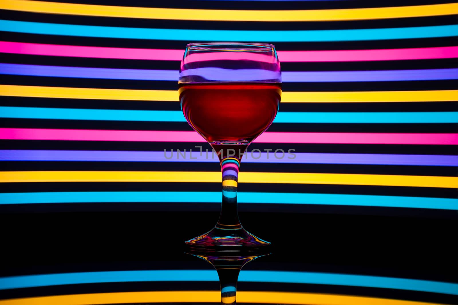Classy colrfull backlit red vine glass with reflection