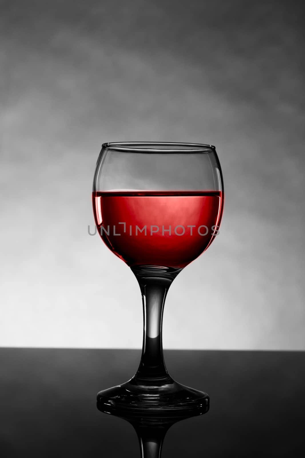 Classy colrfull backlit red vine glass with reflection