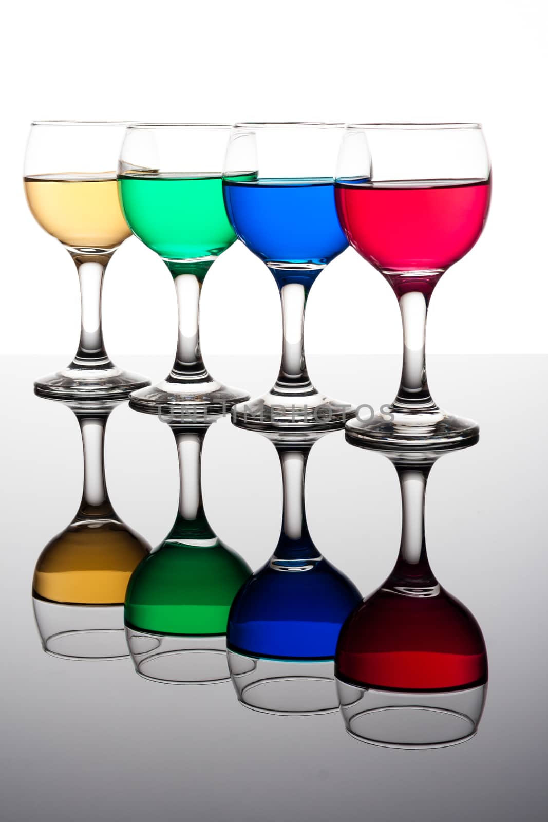 red, green, yellow and blue backlit drinks with reflection