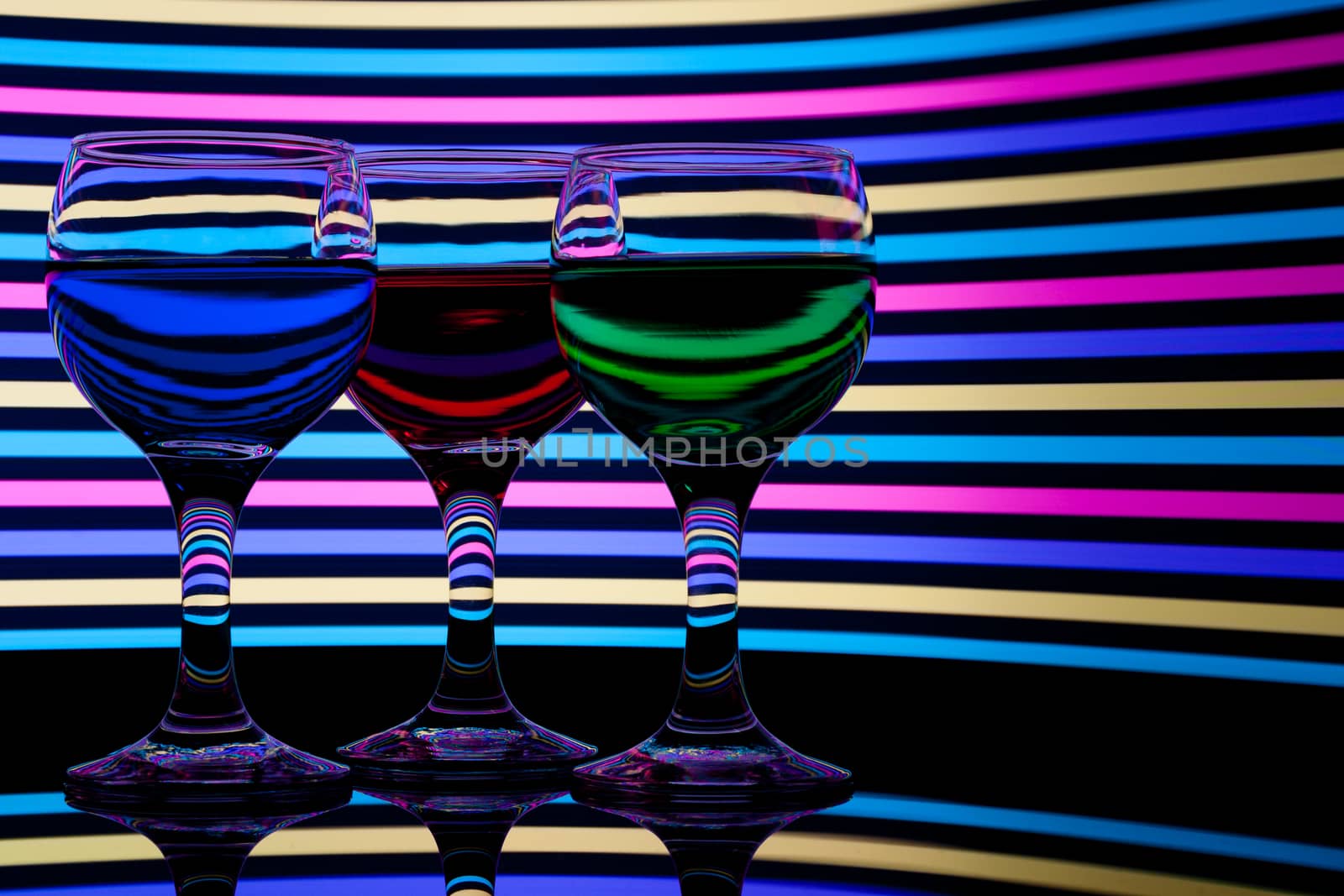 red, green and blue backlit drinks with reflection