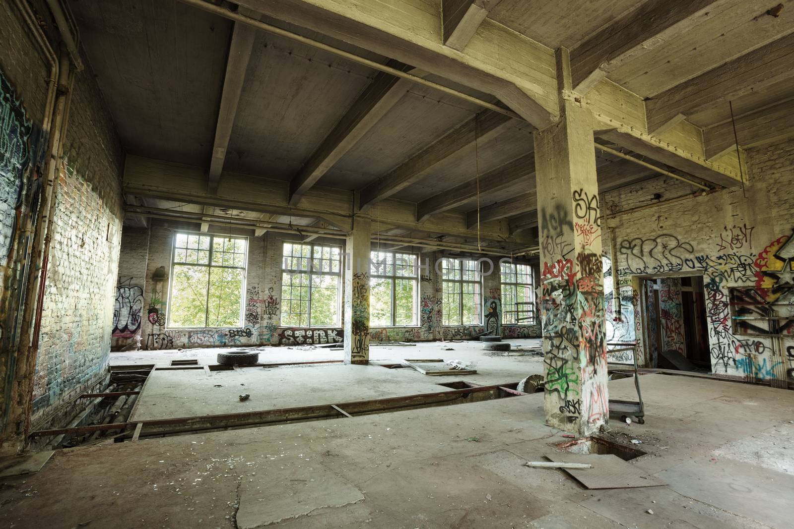 Empty abandoned factory room by juhku