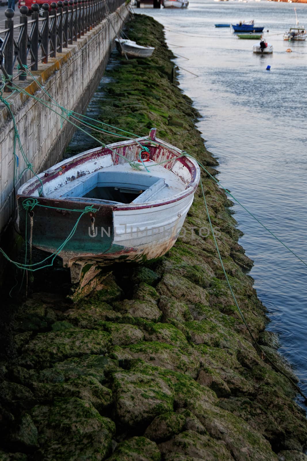 Low tide in an Spanish river with a boat on the rocks