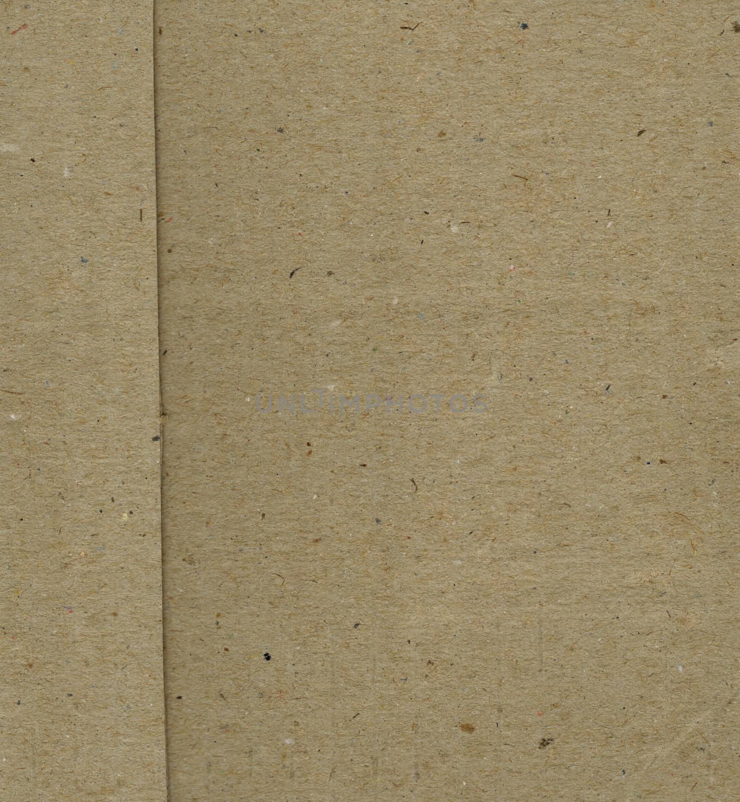 Brown corrugated cardboard sheet useful as a background