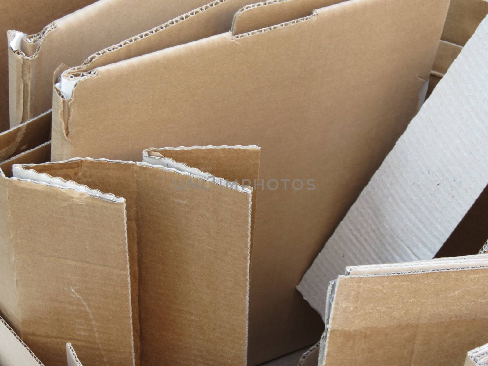 Brown corrugated cardboard sheets useful as a background or recycle concept