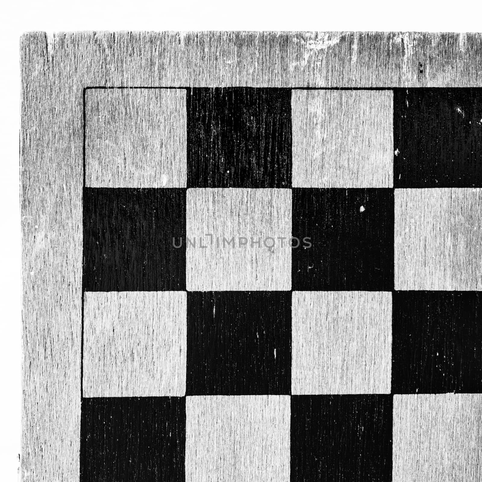 Corner of worn wooden checkkerboard