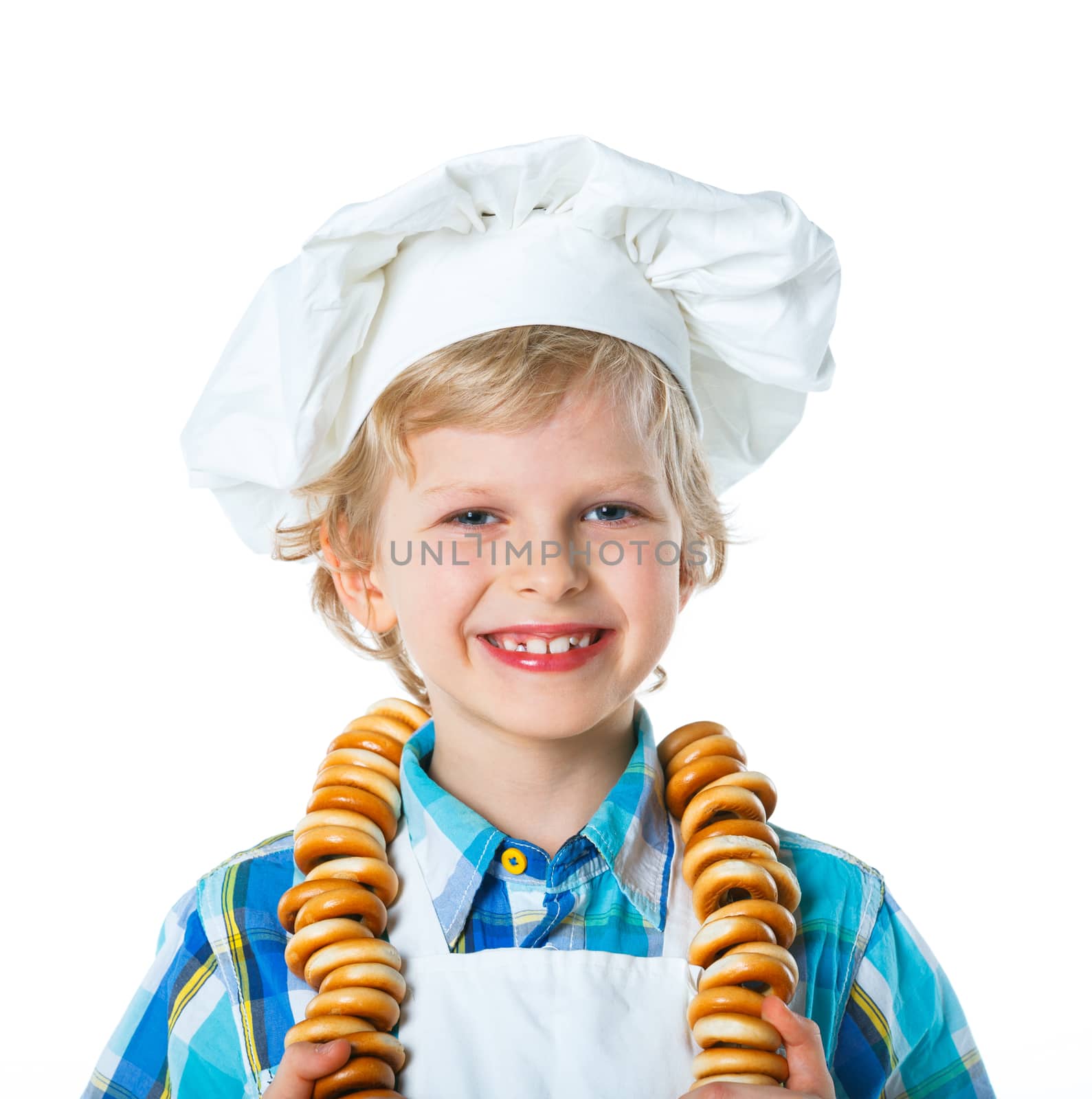 Little Cook Boy With A Bagels. Isolated on white background.