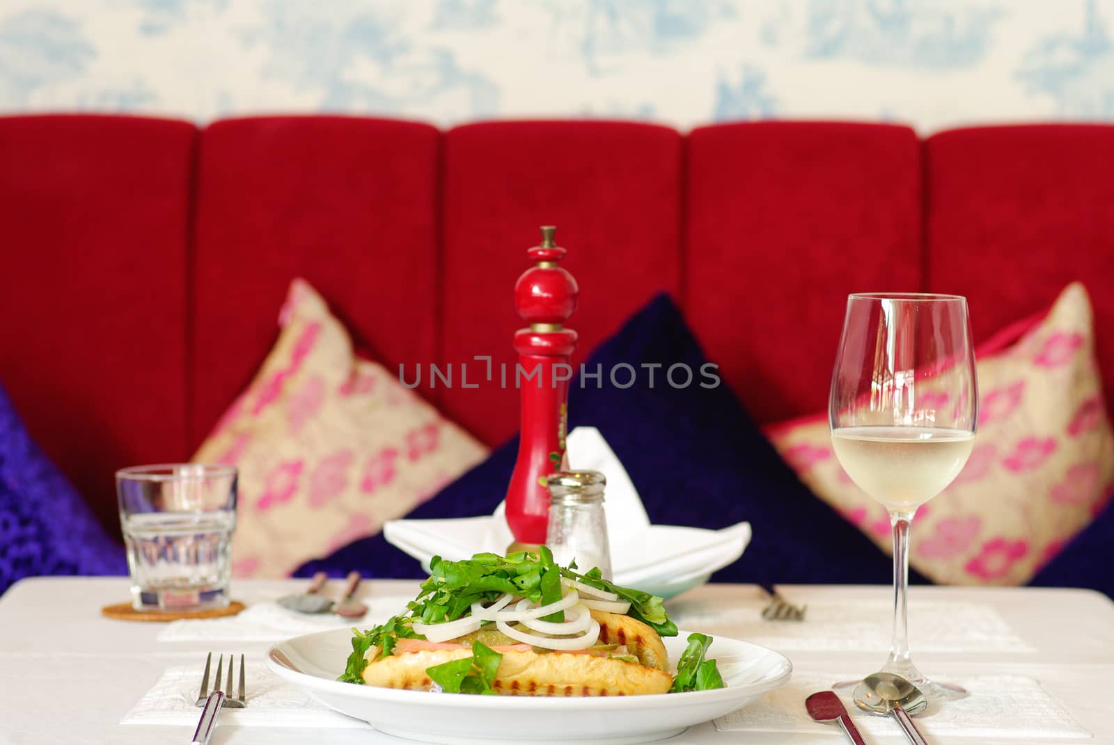 Fine restaurant dinner table place setting: napkin, wineglass