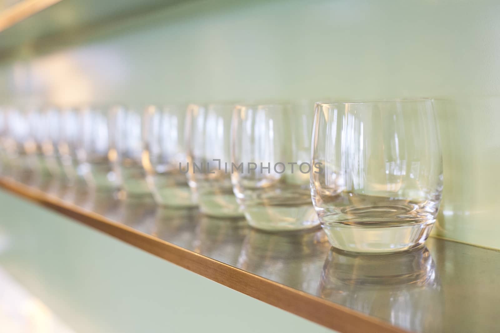 water glass on wooden rack by 2nix