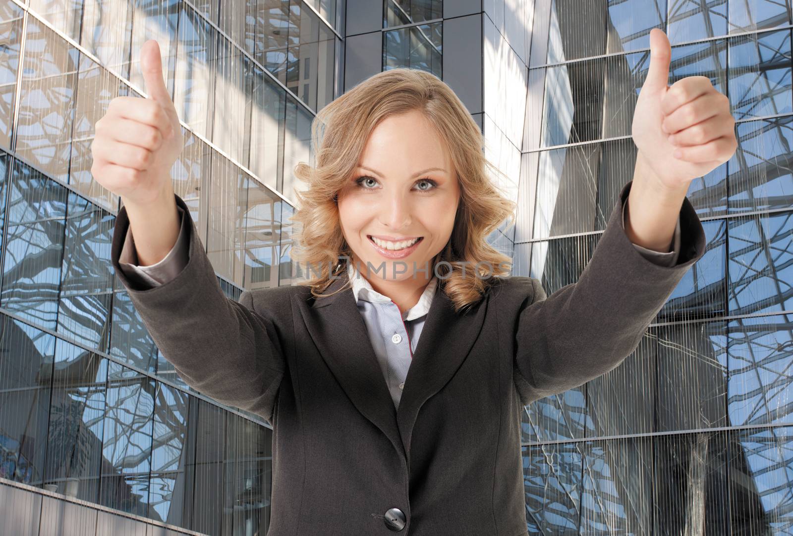 business woman thumbs up smiling by vilevi