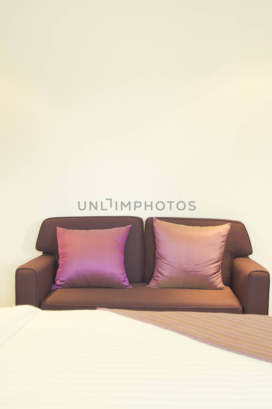 Sofa with pillow in bedroom